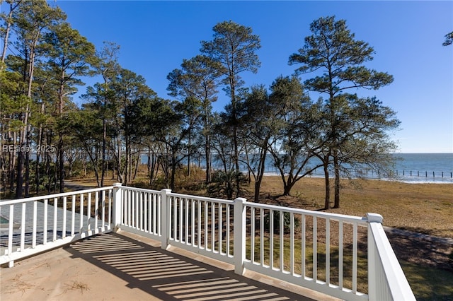 wooden terrace with a water view