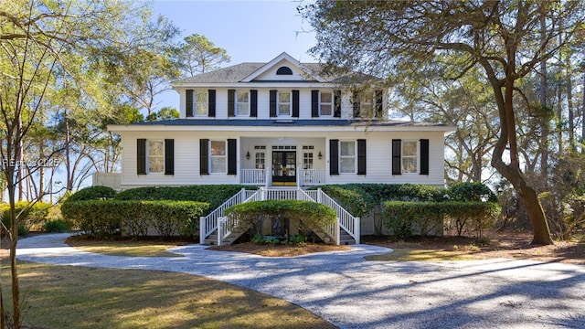 view of front of property featuring a porch and french doors