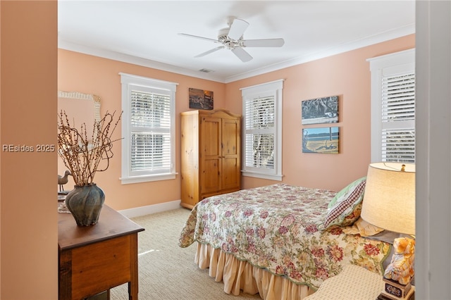 carpeted bedroom with crown molding and ceiling fan