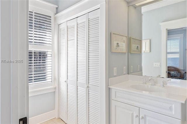 bathroom with vanity and tile patterned floors