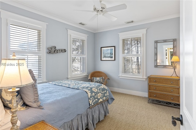 carpeted bedroom featuring ceiling fan, ornamental molding, and multiple windows