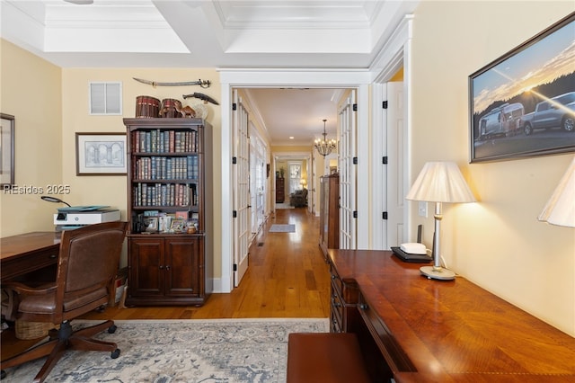 office area with ornamental molding, a chandelier, and light hardwood / wood-style flooring