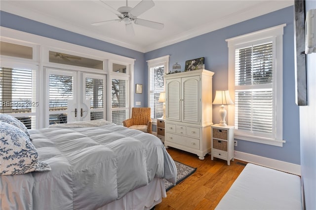 bedroom featuring ceiling fan, access to exterior, multiple windows, and light wood-type flooring