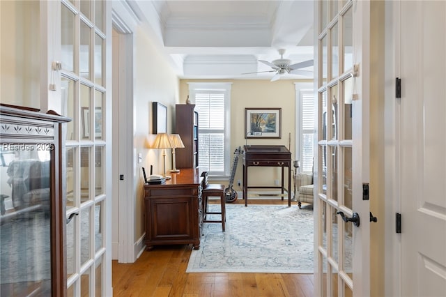 home office with crown molding, light hardwood / wood-style flooring, french doors, and ceiling fan