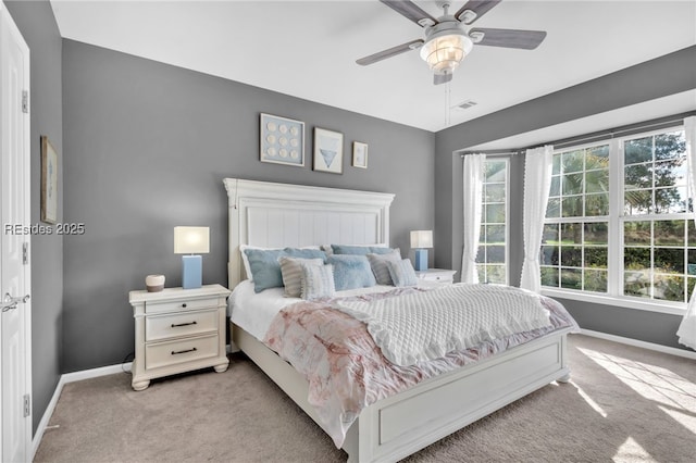 bedroom with light carpet and ceiling fan