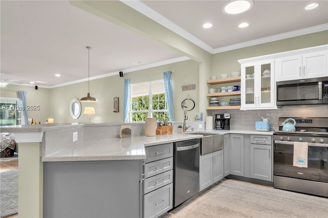 kitchen featuring gray cabinetry, appliances with stainless steel finishes, kitchen peninsula, and white cabinets