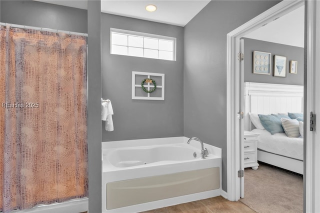 bathroom featuring a tub to relax in