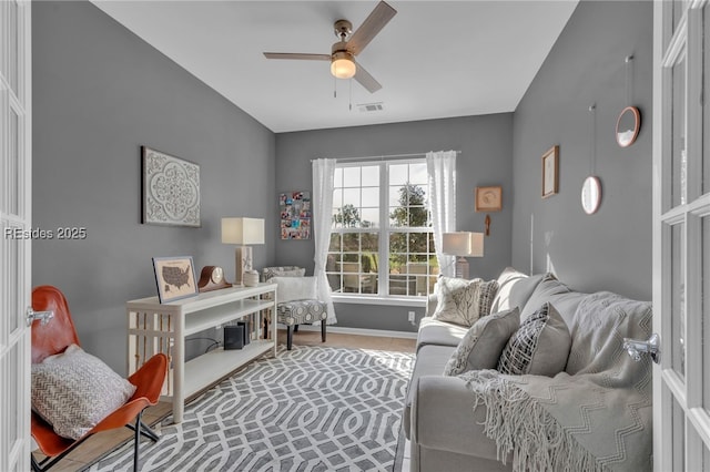 interior space featuring tile patterned flooring and ceiling fan