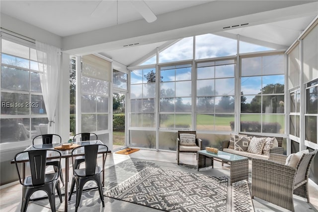 sunroom featuring vaulted ceiling