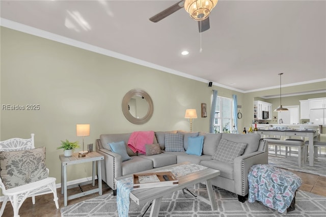 living room featuring ceiling fan and ornamental molding