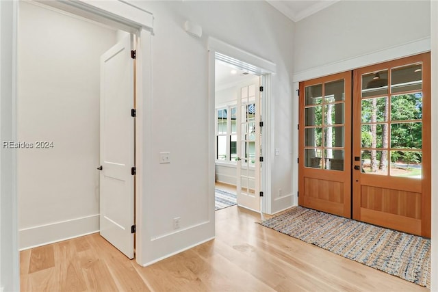 entryway with french doors and light wood-type flooring