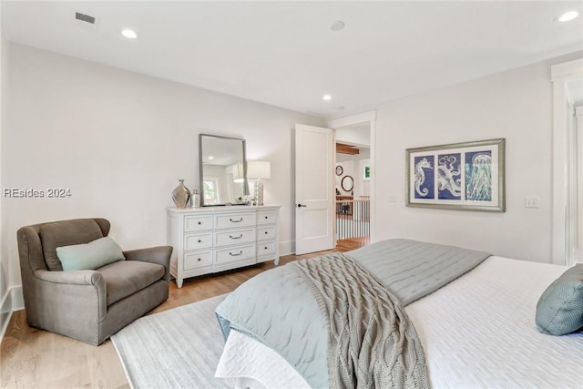 bedroom featuring light wood-type flooring