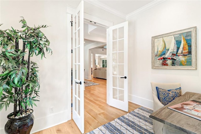 home office with french doors, ornamental molding, and hardwood / wood-style flooring