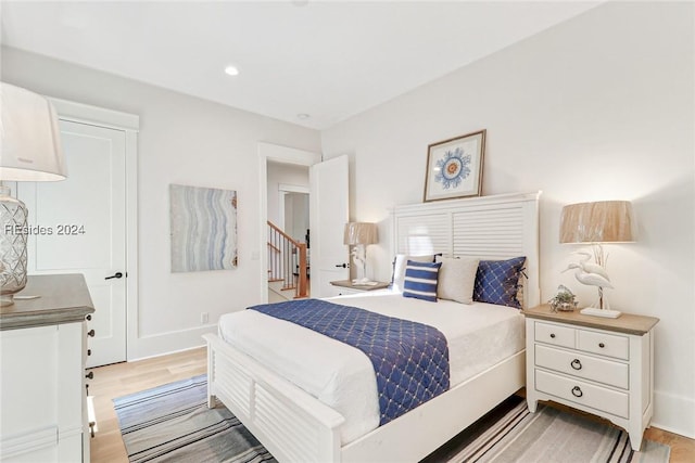 bedroom with light hardwood / wood-style floors