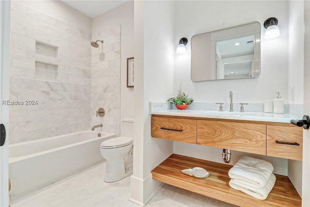 full bathroom with vanity, tiled shower / bath combo, and toilet