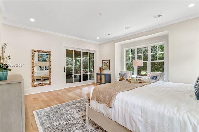 bedroom with ornamental molding, access to outside, and light hardwood / wood-style floors