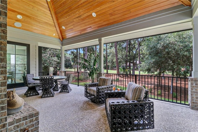 exterior space featuring lofted ceiling and wood ceiling