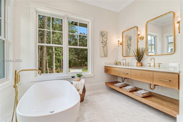 bathroom with concrete flooring, vanity, and crown molding