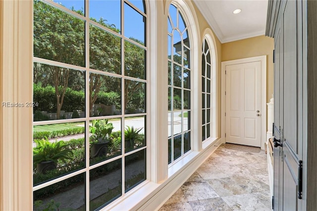 doorway featuring crown molding