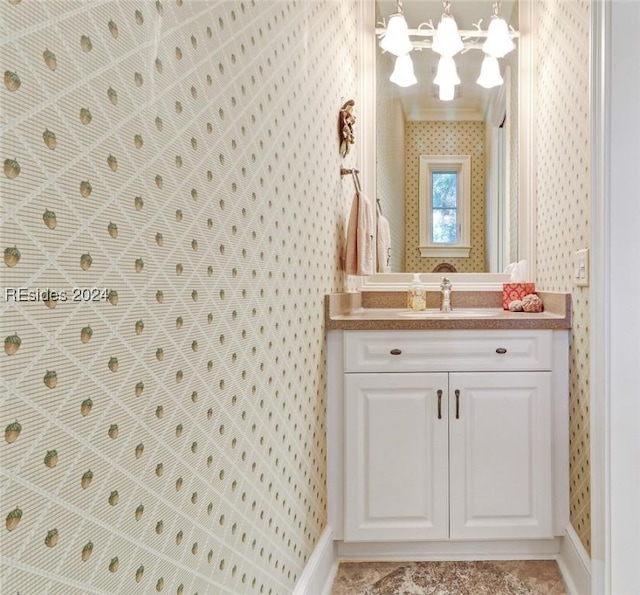 bathroom featuring vanity and crown molding