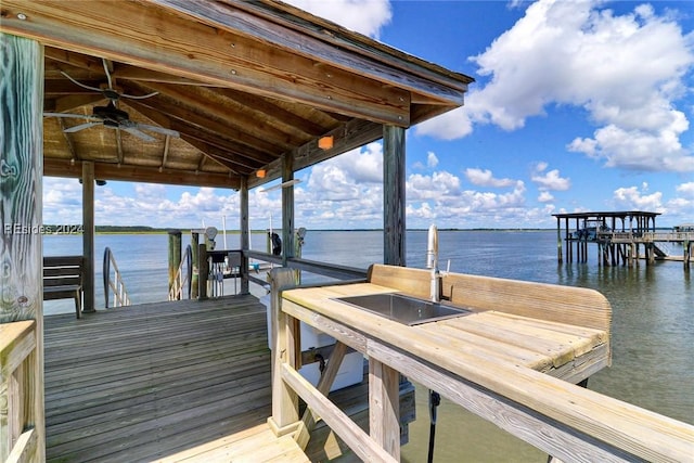 view of dock featuring sink and a water view