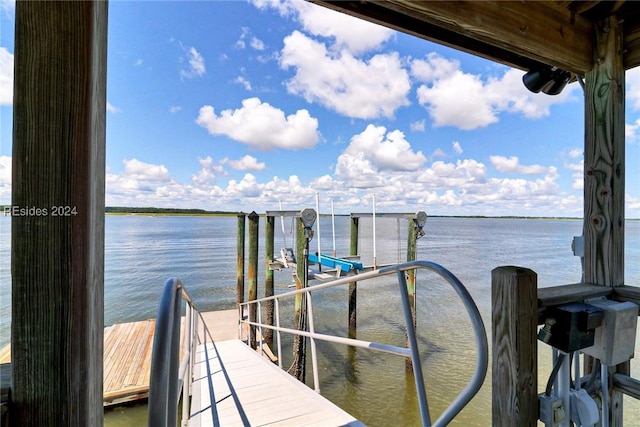 dock area with a water view