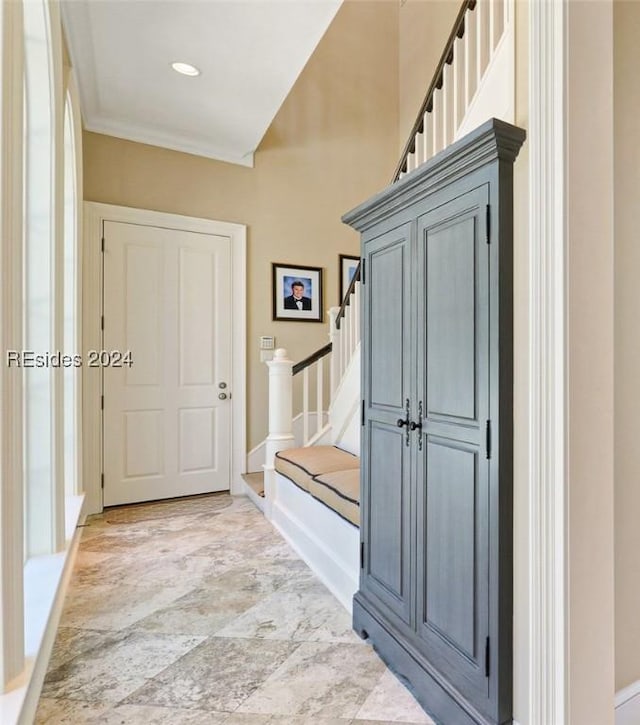 mudroom featuring crown molding