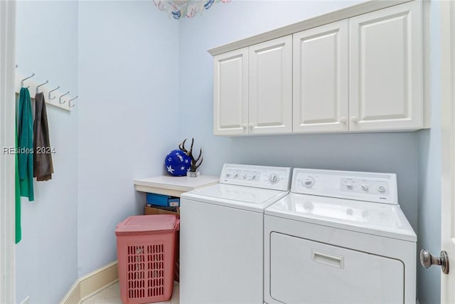 laundry area featuring cabinets and separate washer and dryer