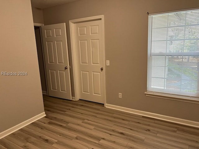 unfurnished bedroom featuring wood-type flooring