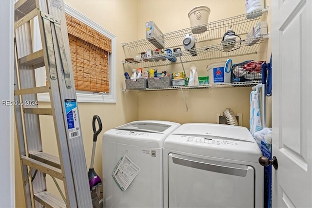 clothes washing area featuring separate washer and dryer