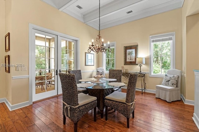 dining area with beamed ceiling, wood-type flooring, a notable chandelier, and french doors