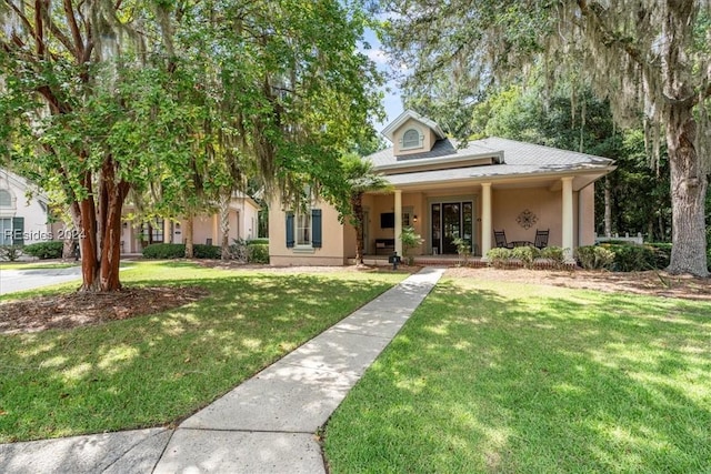 view of front of home with a front yard and covered porch