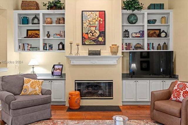 sitting room featuring hardwood / wood-style floors