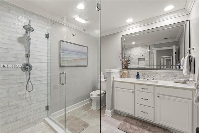 bathroom with a shower with door, vanity, ornamental molding, decorative backsplash, and toilet