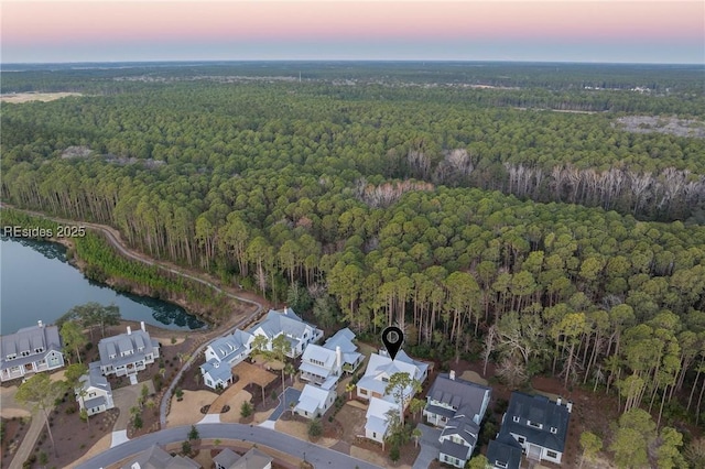 aerial view at dusk with a water view