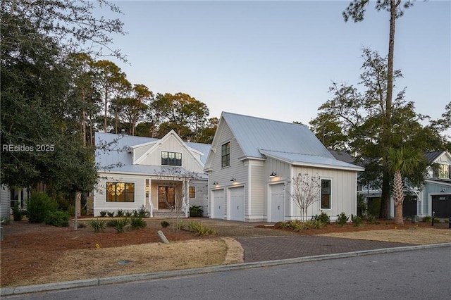 modern farmhouse style home featuring a garage