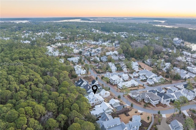 aerial view at dusk with a water view