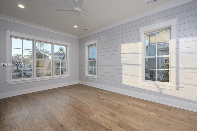 unfurnished sunroom featuring ceiling fan