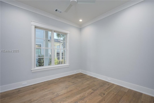 unfurnished room with hardwood / wood-style flooring, ornamental molding, and ceiling fan