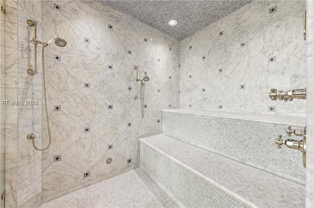 bathroom featuring a tile shower