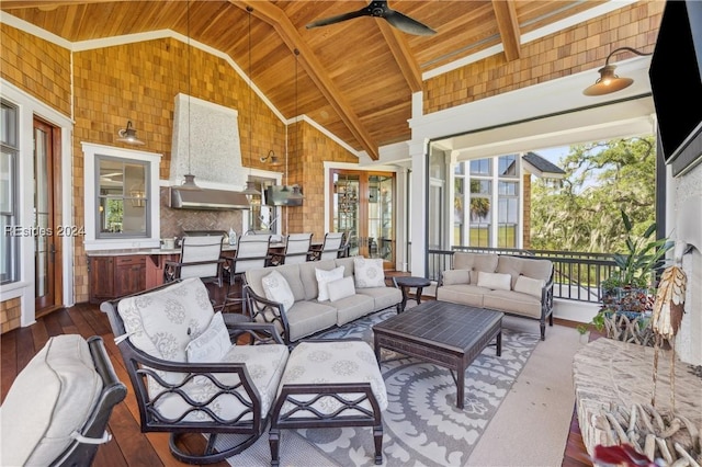 sunroom / solarium with ceiling fan, lofted ceiling, and wood ceiling