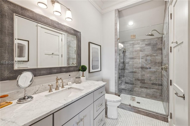 bathroom with crown molding, vanity, toilet, and a shower with door