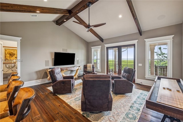 living room featuring beam ceiling, dark wood-type flooring, french doors, and a healthy amount of sunlight