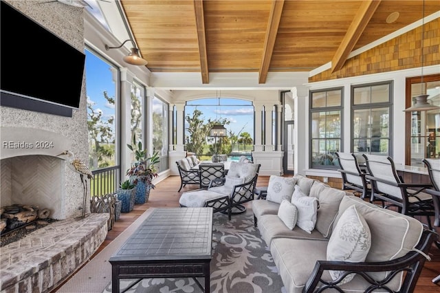 sunroom / solarium with lofted ceiling with beams and wood ceiling