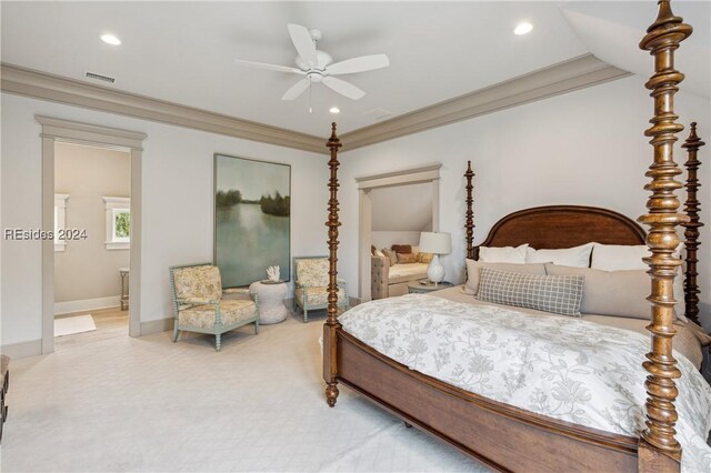 bedroom featuring connected bathroom, crown molding, carpet floors, and ceiling fan