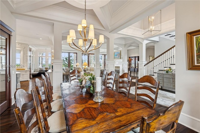 dining space featuring an inviting chandelier, coffered ceiling, dark hardwood / wood-style flooring, and decorative columns