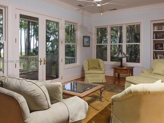 sunroom featuring french doors and ceiling fan