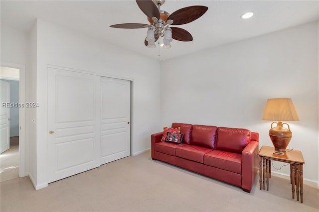 living room with carpet flooring and ceiling fan