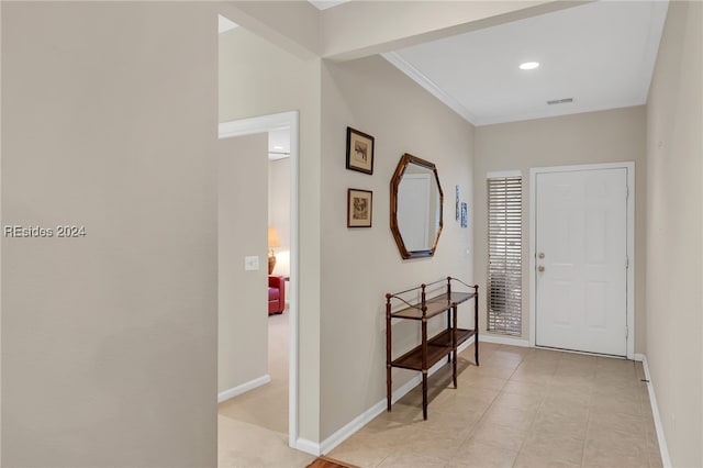 entryway featuring ornamental molding