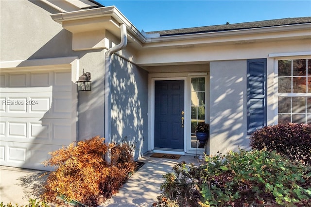 property entrance featuring a garage